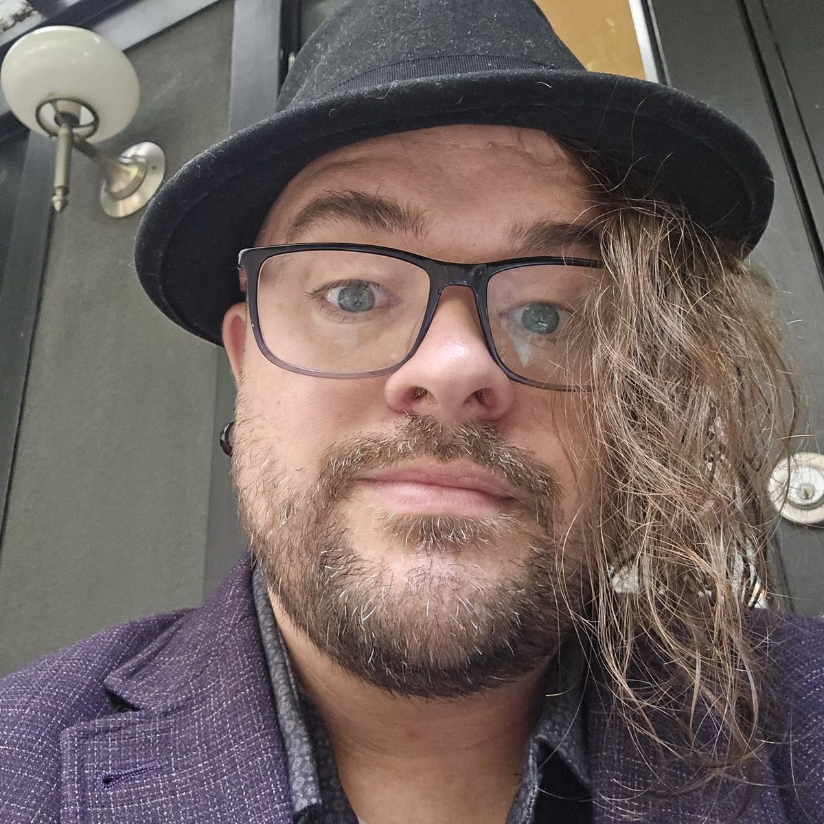 Jason Michaud, fedora and glasses